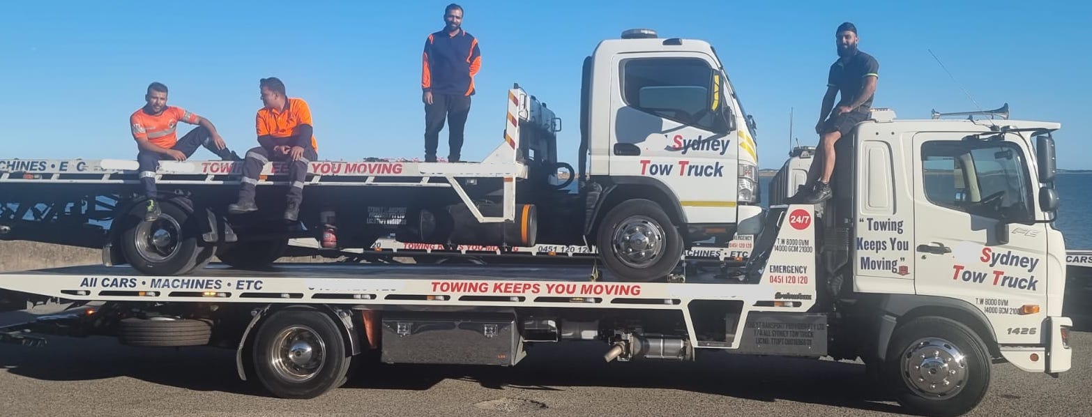 A tow truck towing another tow truck.