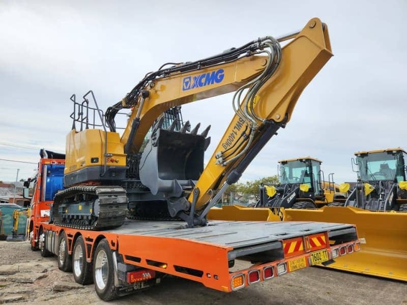 An excavator on a heavy-duty tow truck ready for dispatch near Sydney.